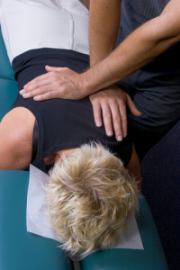 Woman Chiropractic adjustment to back